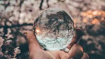 Stock Photo - Philosophy and Psychiatry - hand holding crystal ball